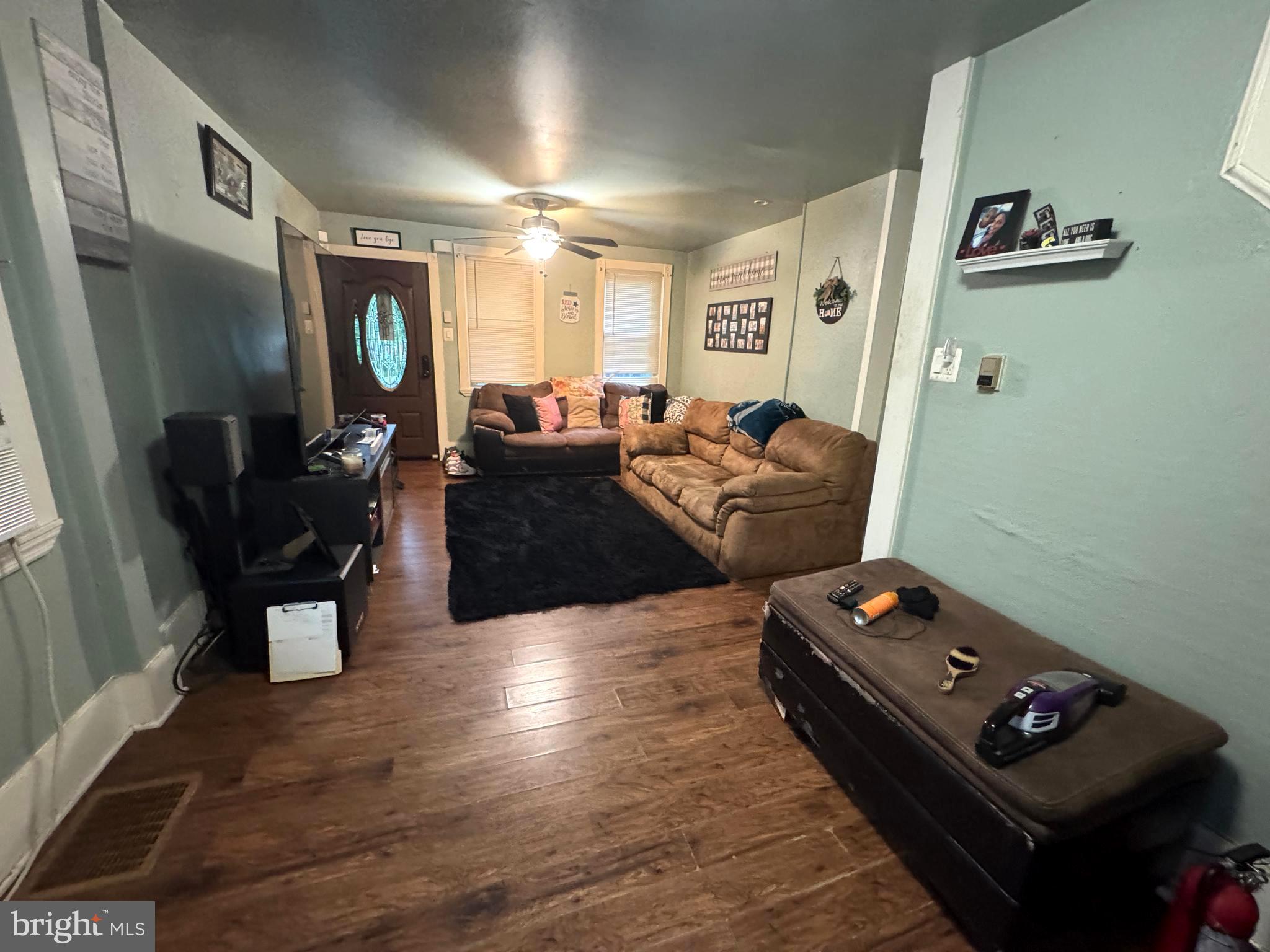 279-281 Arch Street Palmyra, NJ 08065 - Photo 19 of 29 a living room with furniture and a tv