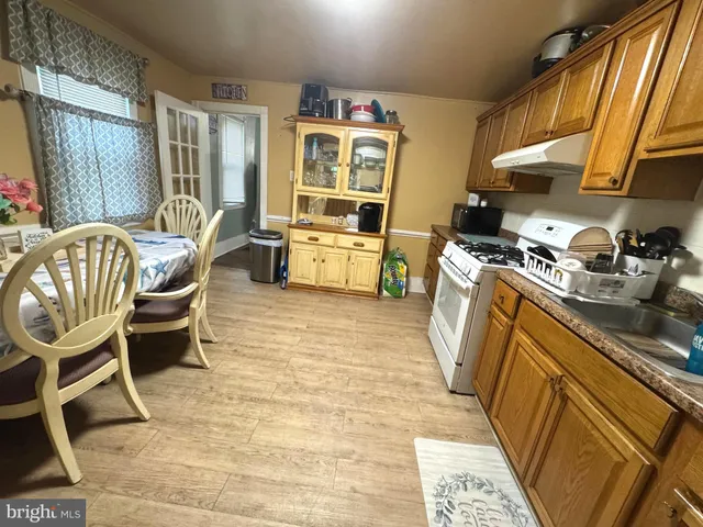a kitchen with a sink and wooden cabinets