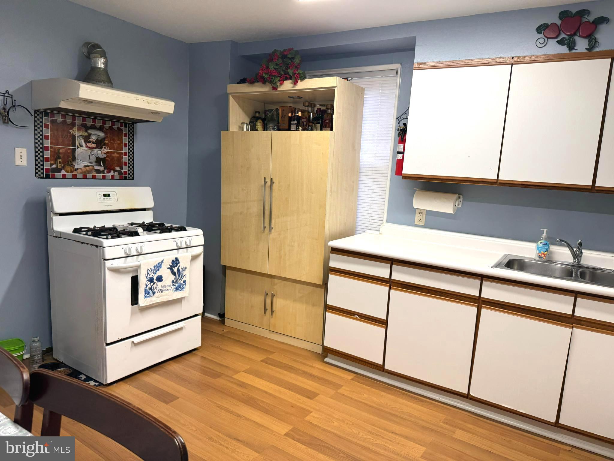 279-281 Arch Street Palmyra, NJ 08065 - Photo 6 of 29 a kitchen with stainless steel appliances a white stove top oven and a refrigerator