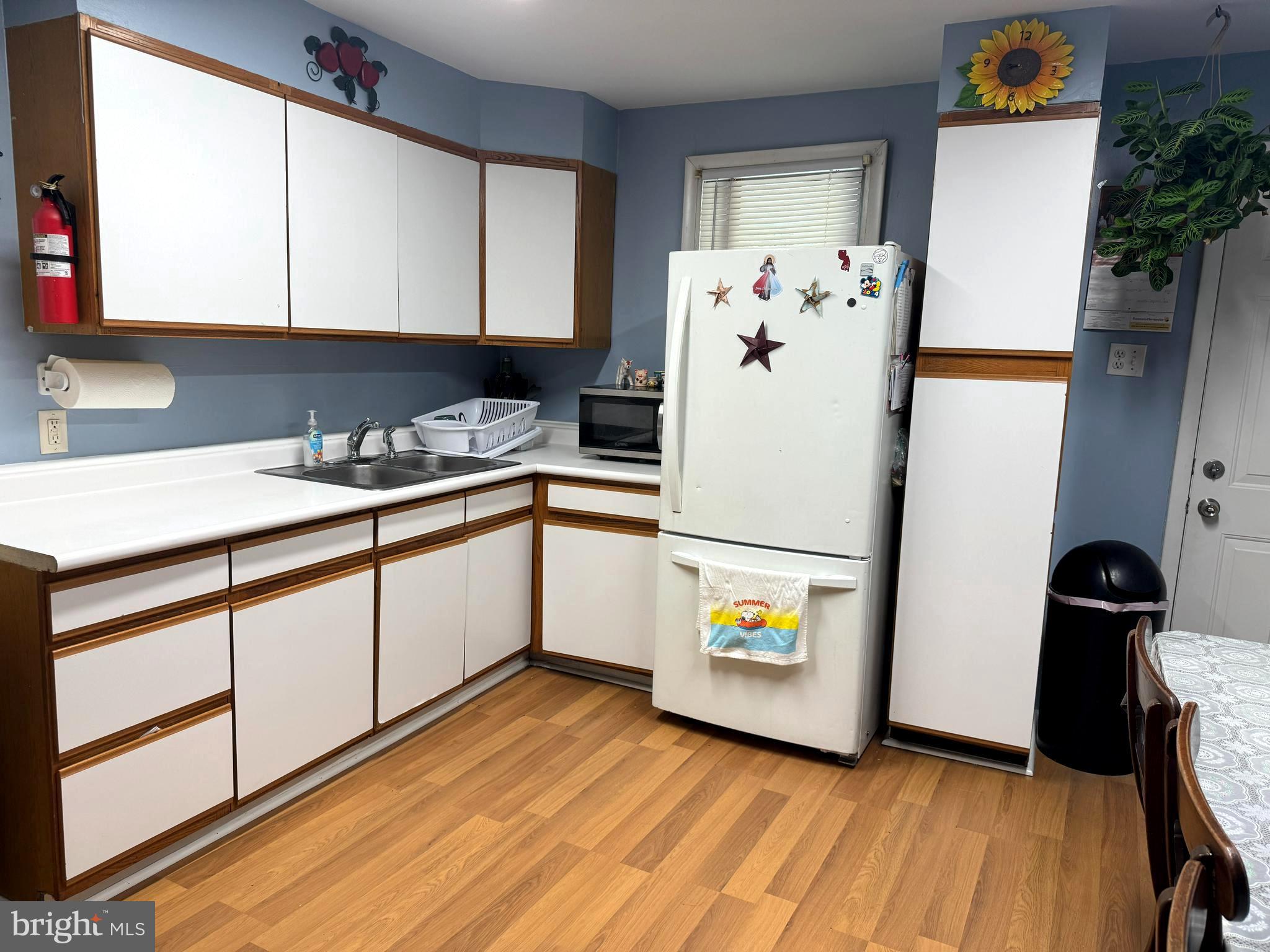 279-281 Arch Street Palmyra, NJ 08065 - Photo 8 of 29 a kitchen with a refrigerator and window