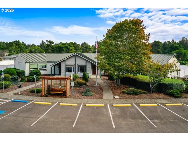 an aerial view of a house a yard and outdoor seating