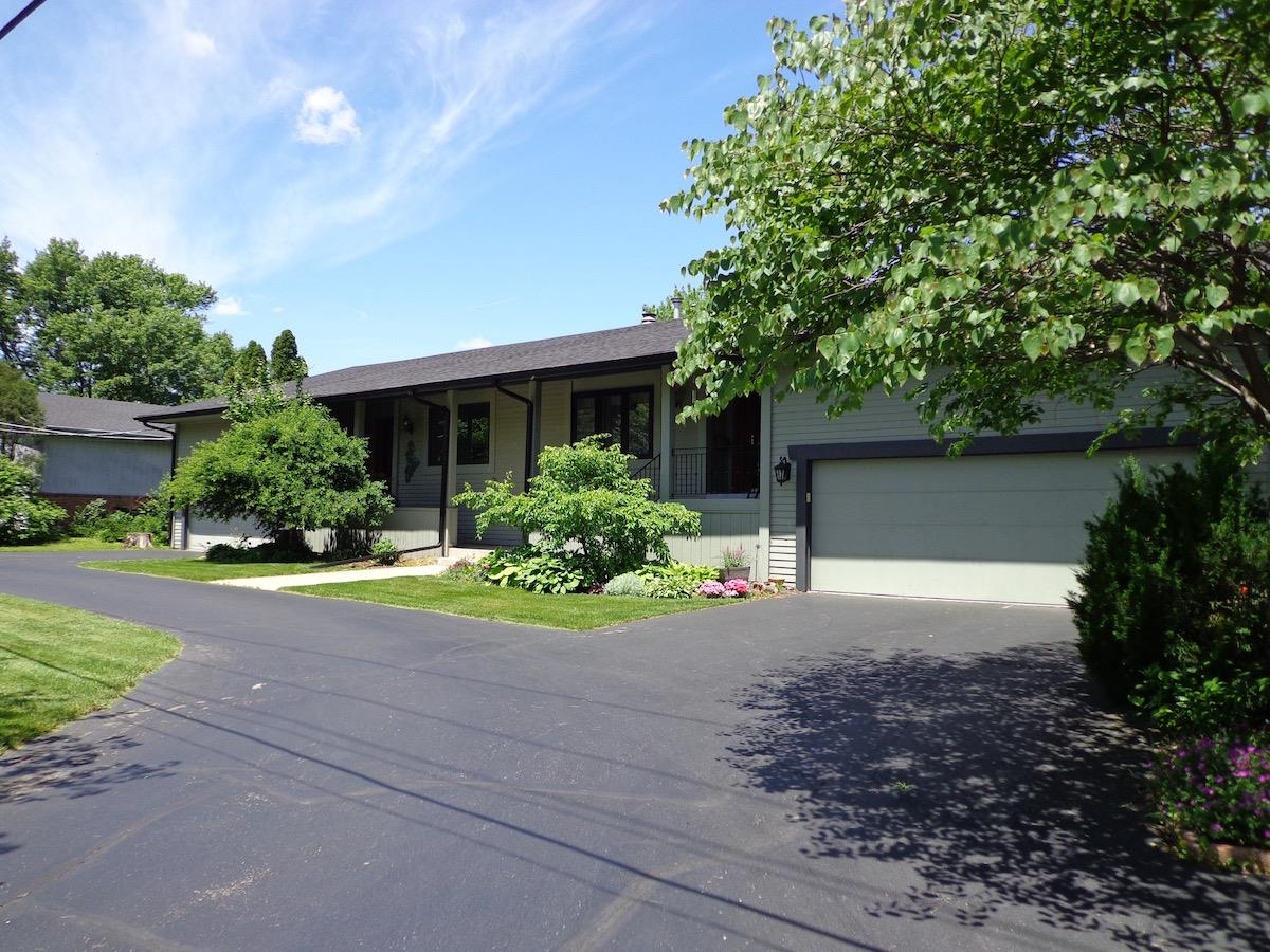 5724 Spring Brook Road Rockford, IL 61114 - Photo 2 of 37 a front view of house with yard and green space