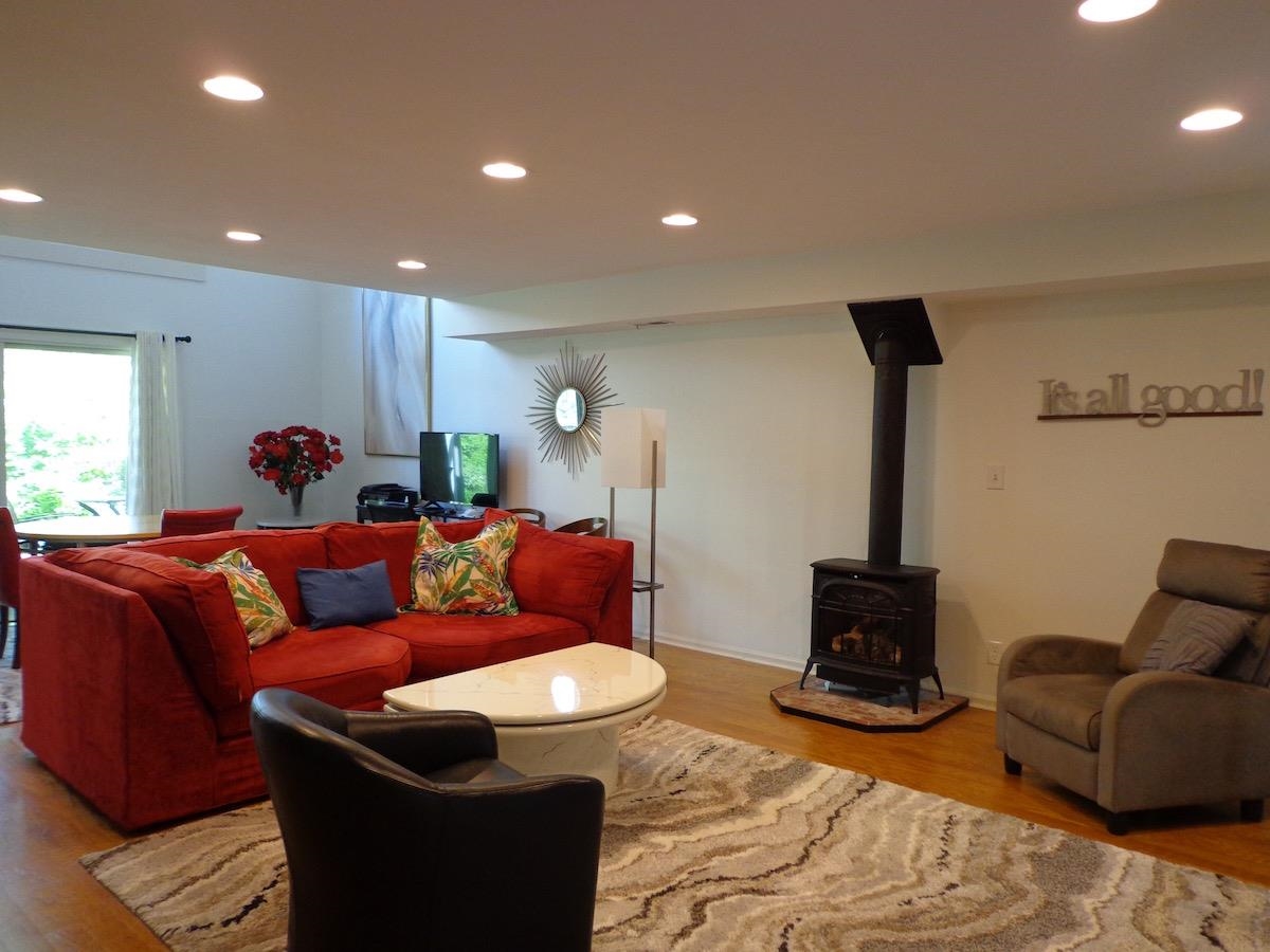 5724 Spring Brook Road Rockford, IL 61114 - Photo 23 of 37 a living room with furniture a couch and a fireplace