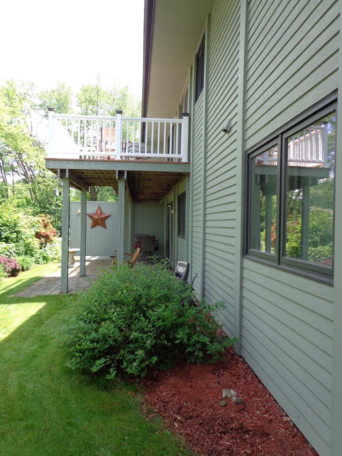 5724 Spring Brook Road Rockford, IL 61114 - Photo 31 of 37 a view of a house with backyard and porch