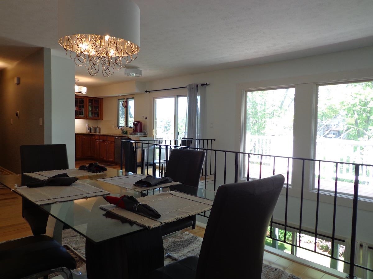 5724 Spring Brook Road Rockford, IL 61114 - Photo 7 of 37 a view of a dining room with furniture a chandelier and a window