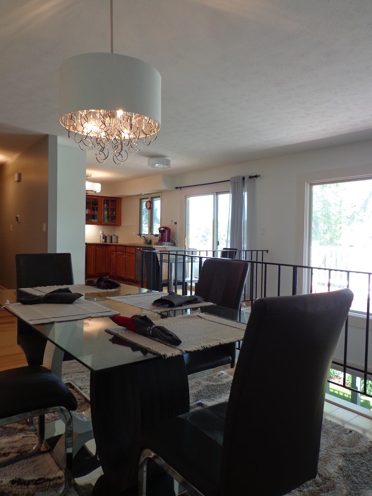 5724 Spring Brook Road Rockford, IL 61114 - Photo 9 of 37 a living room with furniture a chandelier and a dining table