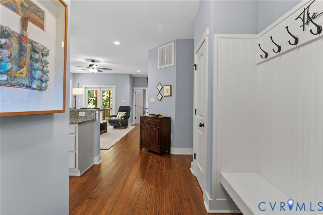 Mudroom featuring dark wood-type flooring, recesse