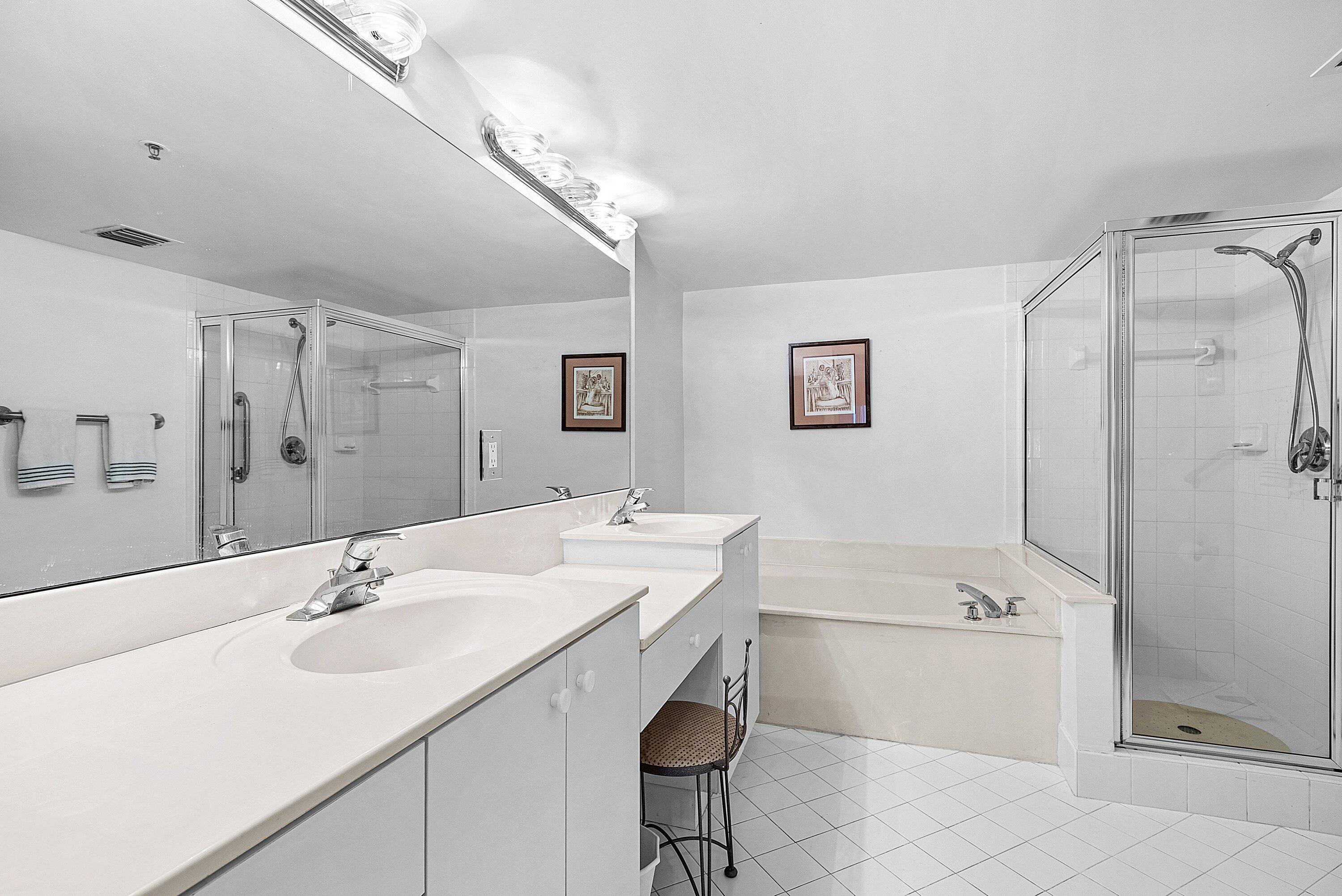 12560 Majesty Circle, Unit 303 Boynton Beach, FL 33437 - Photo 23 of 33 a bathroom with a sink a toilet and shower