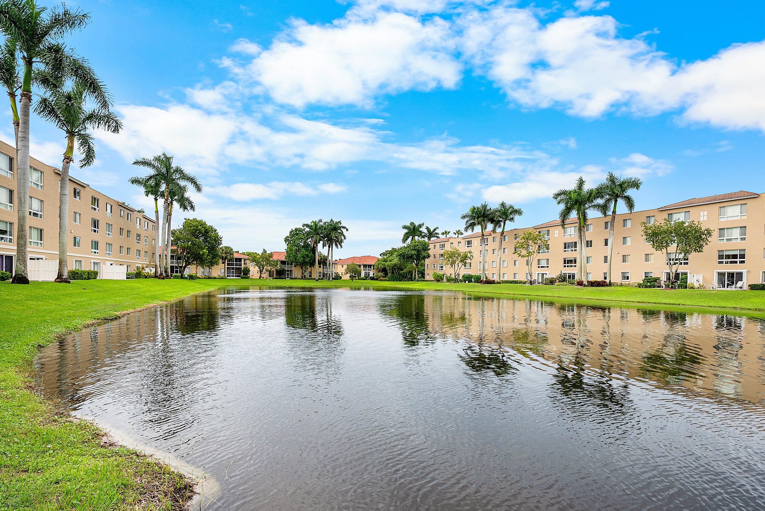 12560 Majesty Circle, Unit 303 Boynton Beach, FL 33437 - Photo 32 of 33 a view of a lake with houses in outdoor space