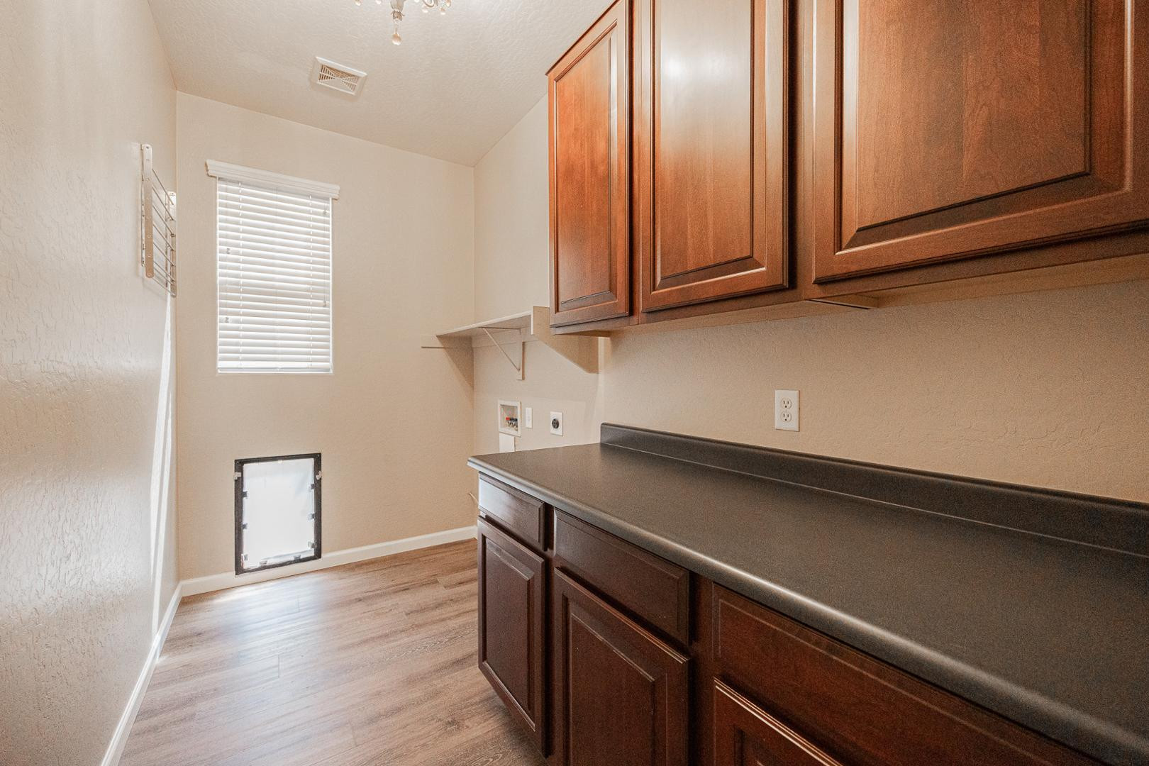 6539 West Jomax Road Phoenix, AZ 85083 - Photo 30 of 39 a view of a microwave and cabinets