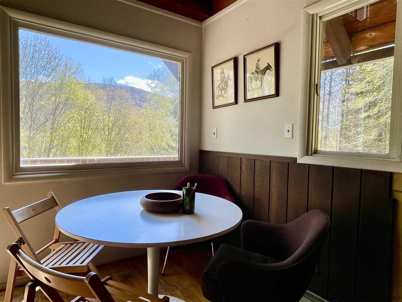 187 Deer Run Road Roxbury, NY 12421 - Photo 13 of 28 a view of a dining room with furniture window and outside view