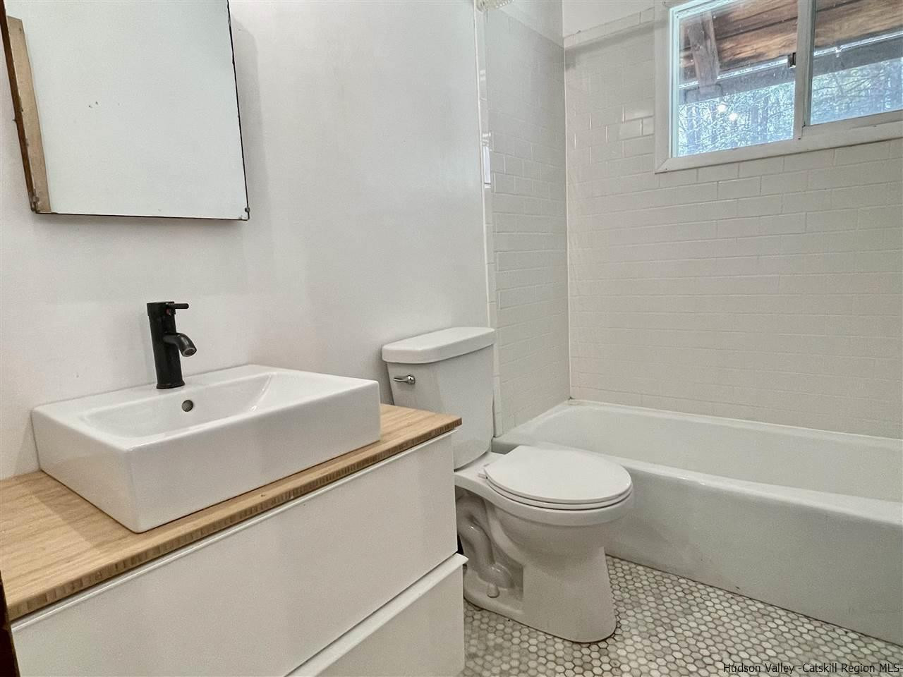 187 Deer Run Road Roxbury, NY 12421 - Photo 21 of 28 a bathroom with a sink toilet and a bathtub