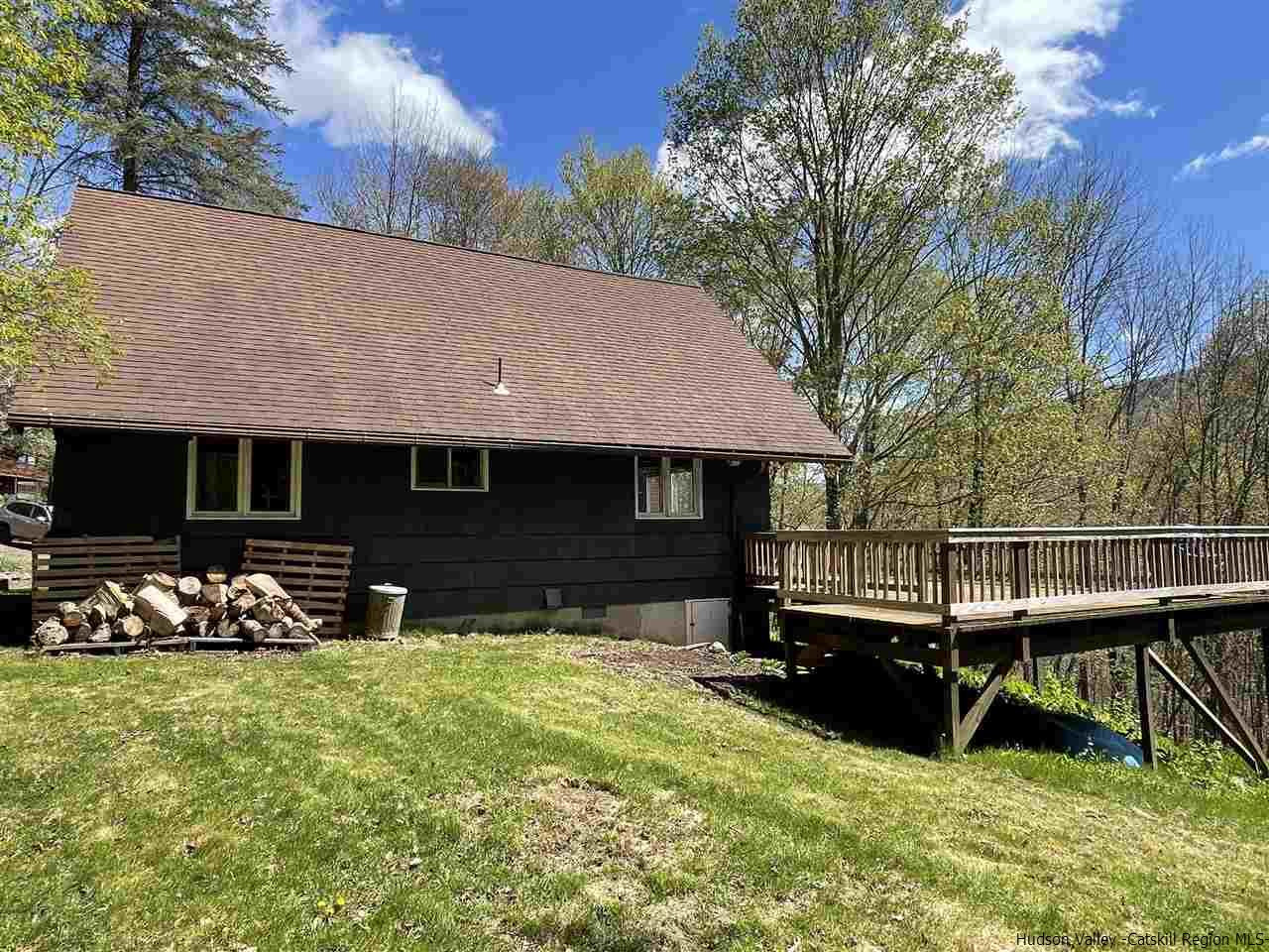 187 Deer Run Road Roxbury, NY 12421 - Photo 6 of 28 a view of a house with backyard and sitting area