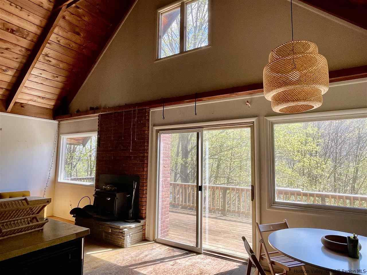 187 Deer Run Road Roxbury, NY 12421 - Photo 8 of 28 a bedroom with furniture and a window