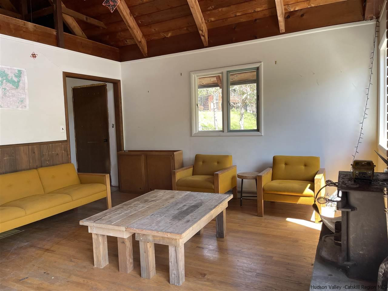 187 Deer Run Road Roxbury, NY 12421 - Photo 9 of 28 a living room with furniture and wooden floor