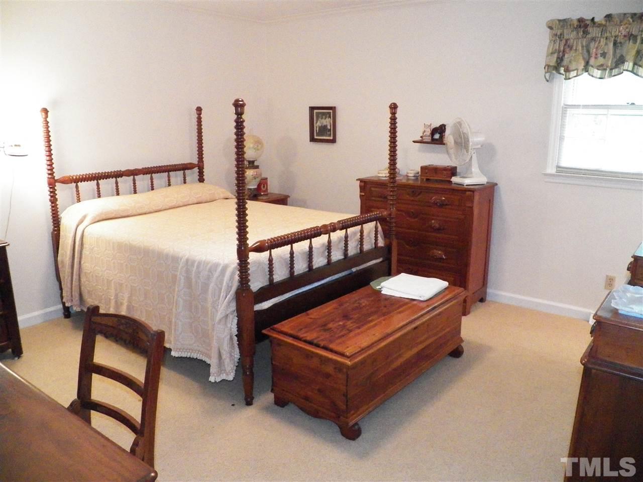 5204 Knollwood Road Raleigh, NC 27609 - Photo 17 of 25 a bedroom with furniture and window
