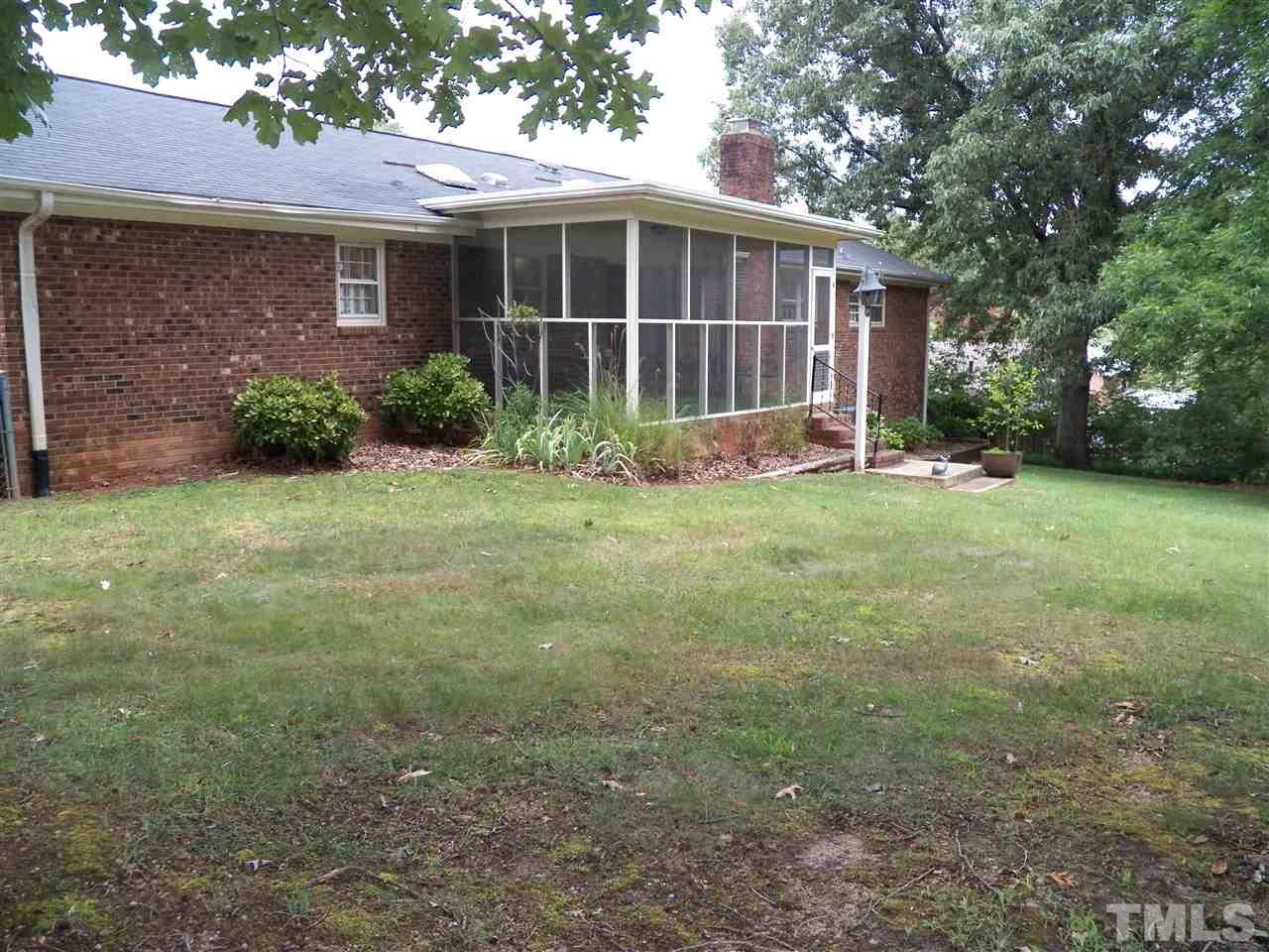 5204 Knollwood Road Raleigh, NC 27609 - Photo 24 of 25 a view of a house with yard and a garden