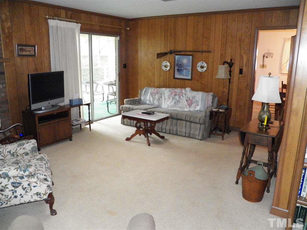 5204 Knollwood Road Raleigh, NC 27609 - Photo 7 of 25 a living room with furniture and a flat screen tv