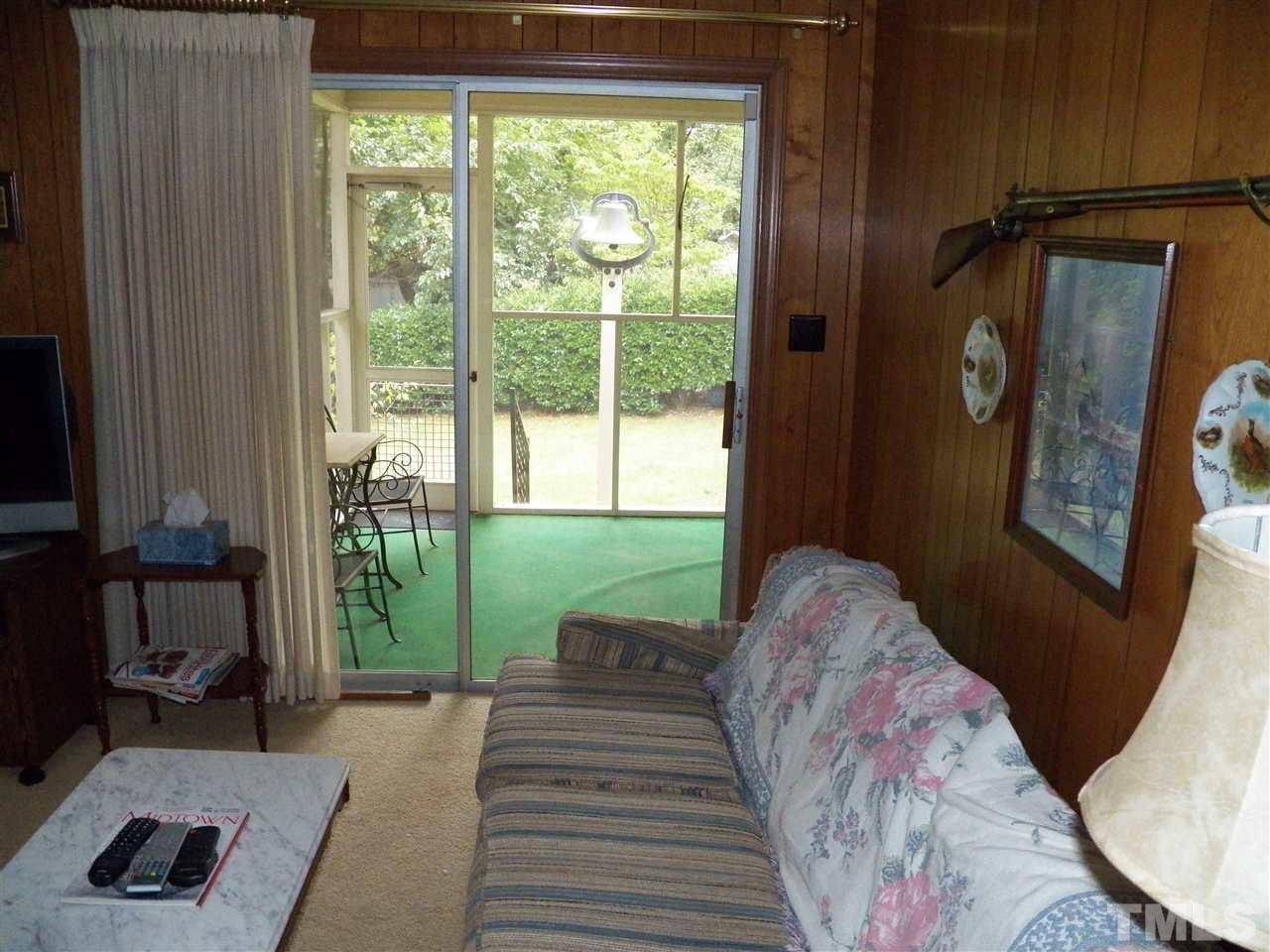 5204 Knollwood Road Raleigh, NC 27609 - Photo 8 of 25 a bed sitting in a bedroom next to a window