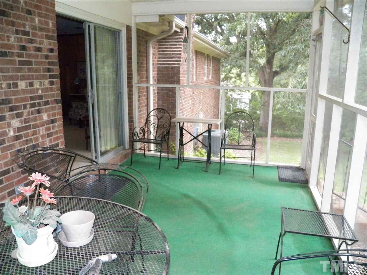 5204 Knollwood Road Raleigh, NC 27609 - Photo 9 of 25 a view of a porch with chairs and a yard
