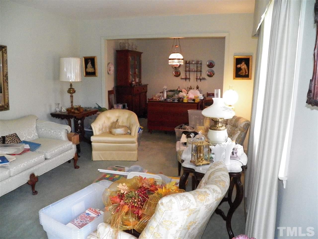 5204 Knollwood Road Raleigh, NC 27609 - Photo 10 of 25 a living room with furniture and a wooden floor