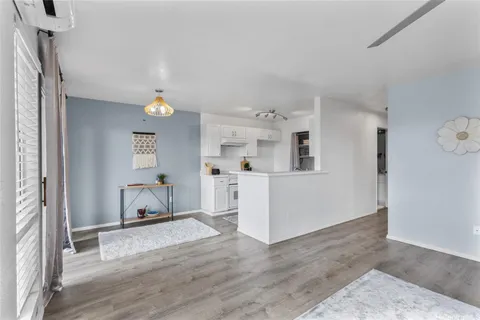 a view of kitchen with furniture and wooden floor