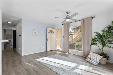 a spacious bedroom with a bed and a window