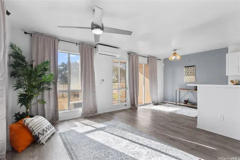 a bedroom with furniture and a potted plant