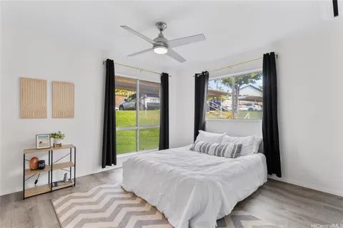 a bedroom with a large bed and a window