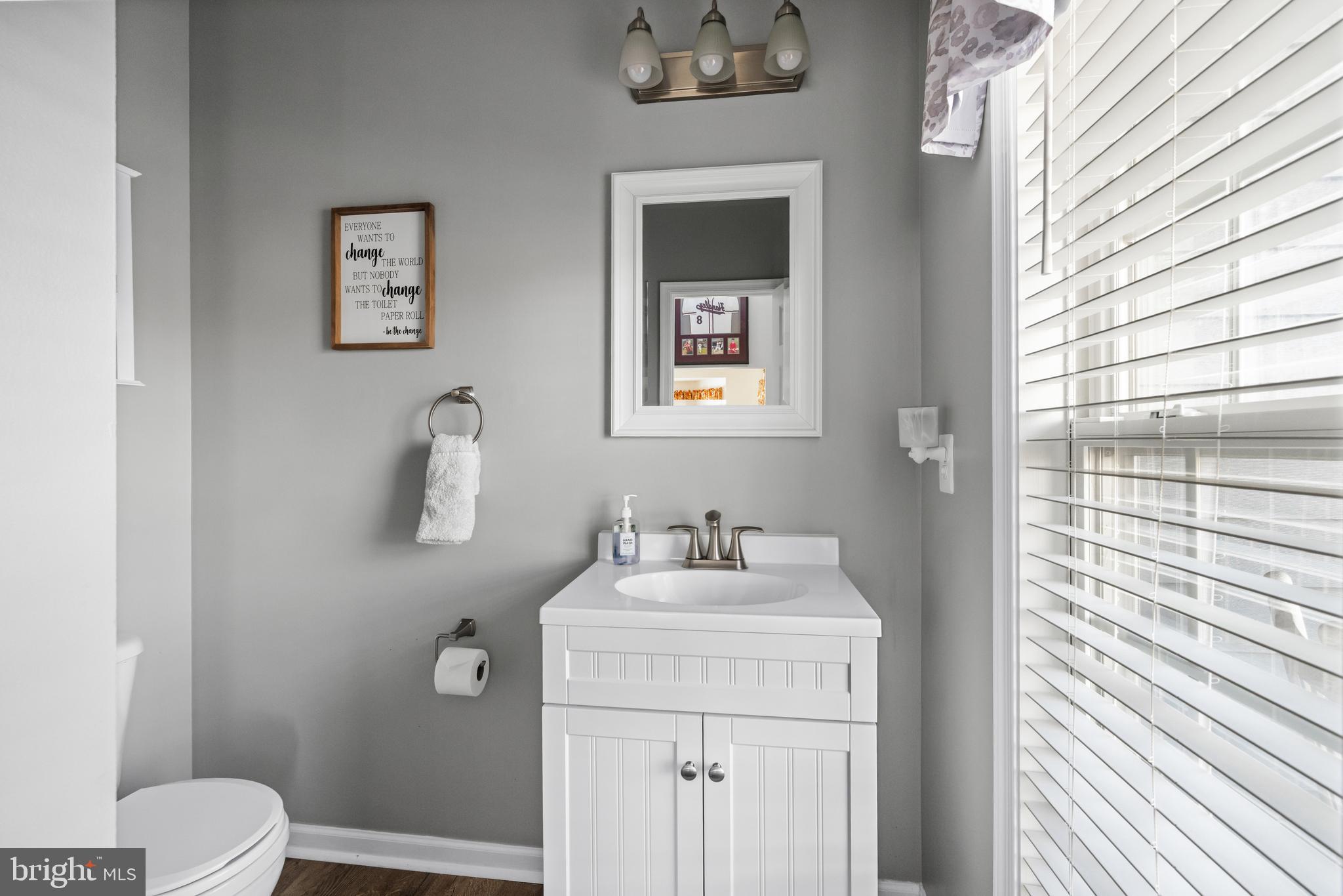 404 Pinnacle Drive Bunker Hill, WV 25413 - Photo 17 of 36 a bathroom with a sink toilet and vanity