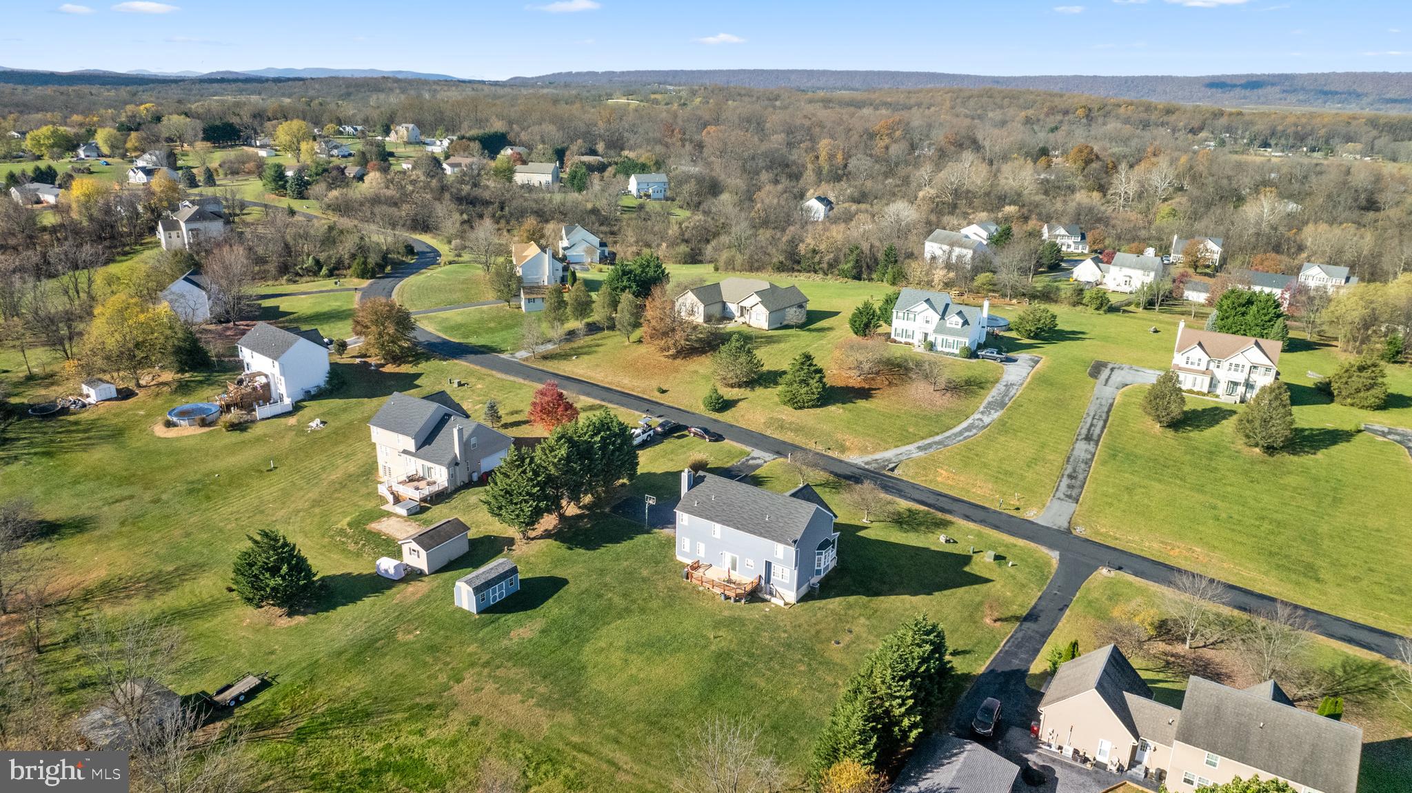 404 Pinnacle Drive Bunker Hill, WV 25413 - Photo 2 of 36 an aerial view of residential houses with outdoor space