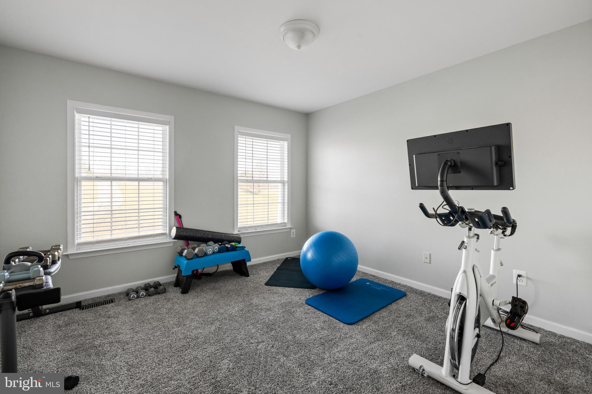 404 Pinnacle Drive Bunker Hill, WV 25413 - Photo 21 of 36 a living room with furniture and a flat screen tv