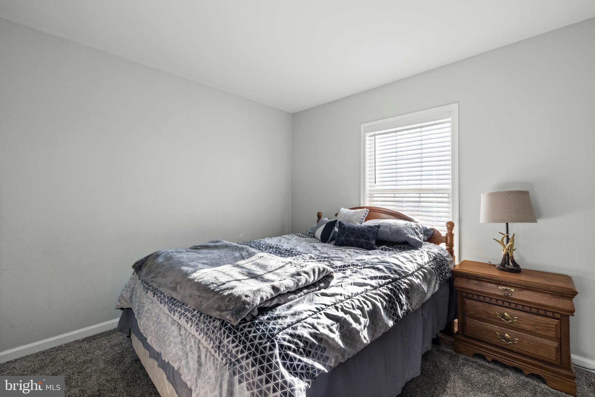 404 Pinnacle Drive Bunker Hill, WV 25413 - Photo 23 of 36 a bedroom with a bed and a window