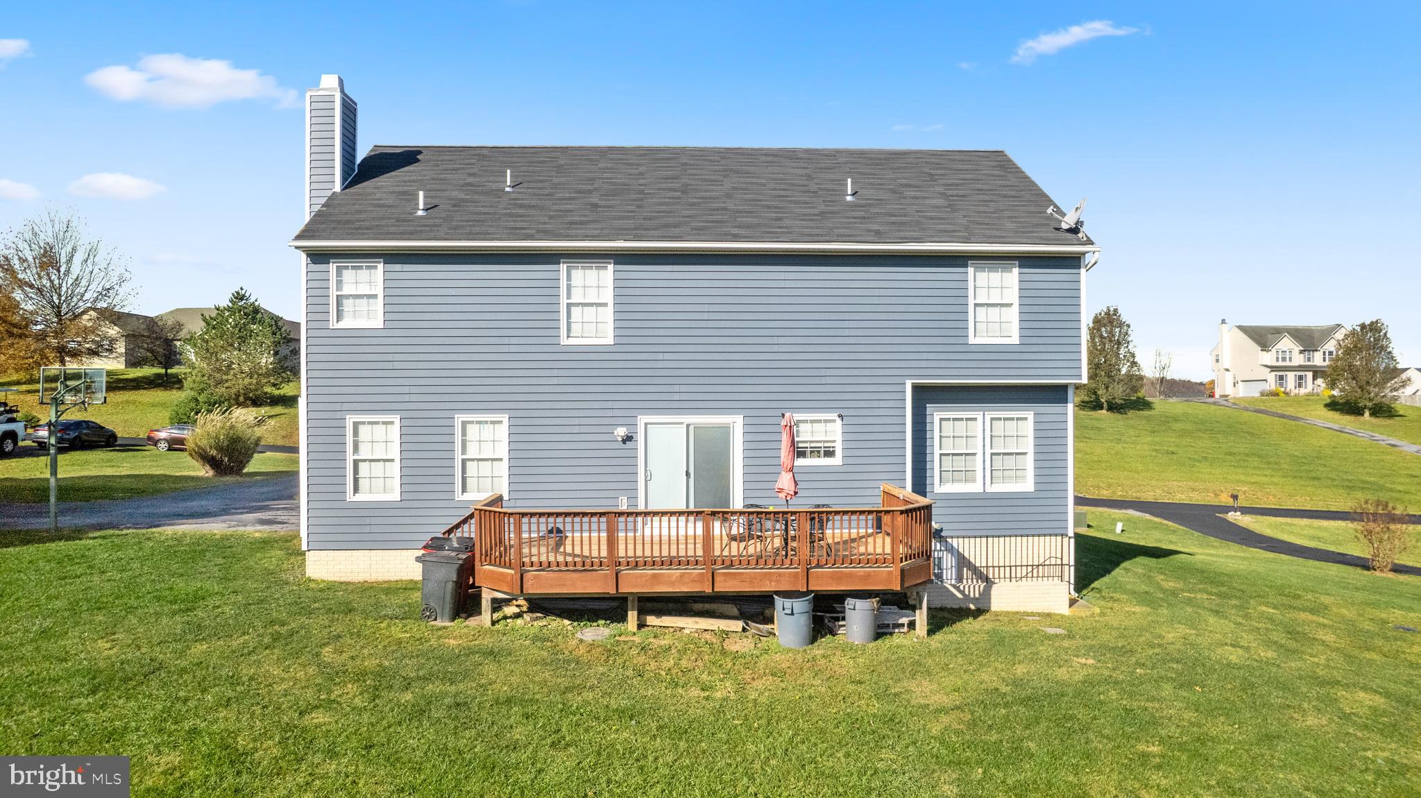 404 Pinnacle Drive Bunker Hill, WV 25413 - Photo 29 of 36 a front view of a house with a garden