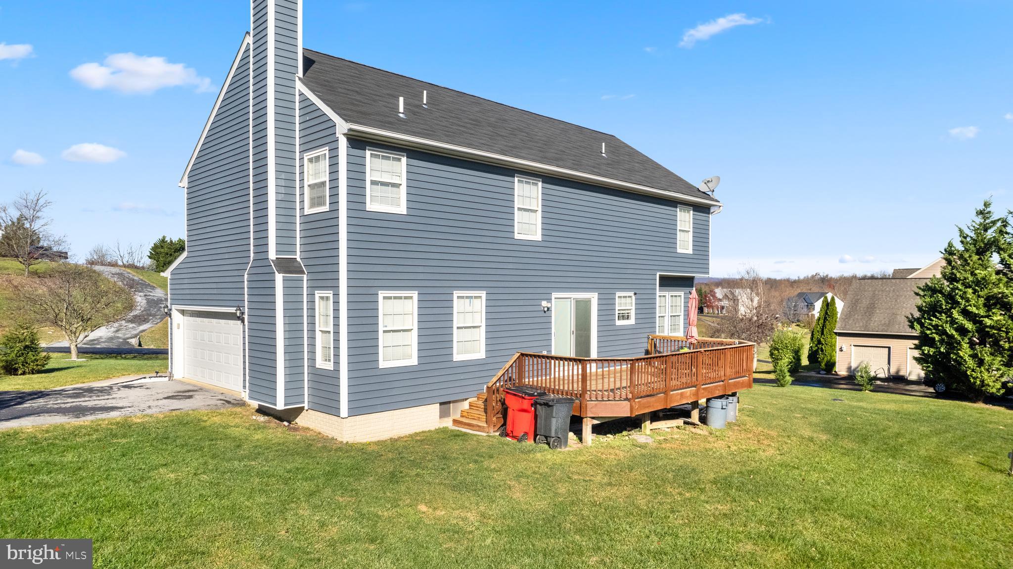 404 Pinnacle Drive Bunker Hill, WV 25413 - Photo 36 of 36 a backyard of a house with table and chairs