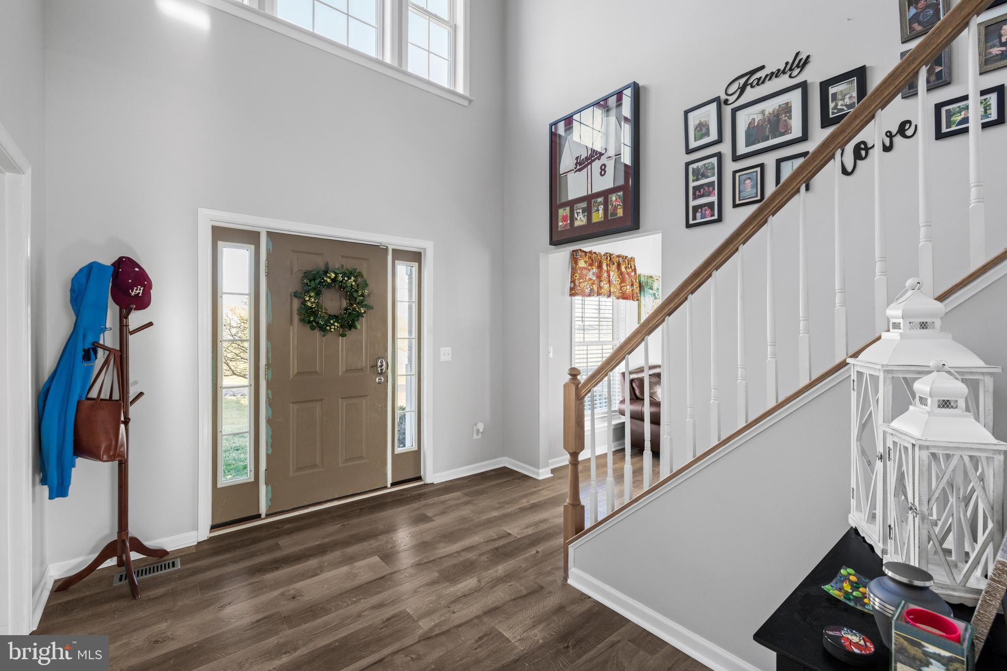 404 Pinnacle Drive Bunker Hill, WV 25413 - Photo 4 of 36 a view of entryway with wooden floor and stairs