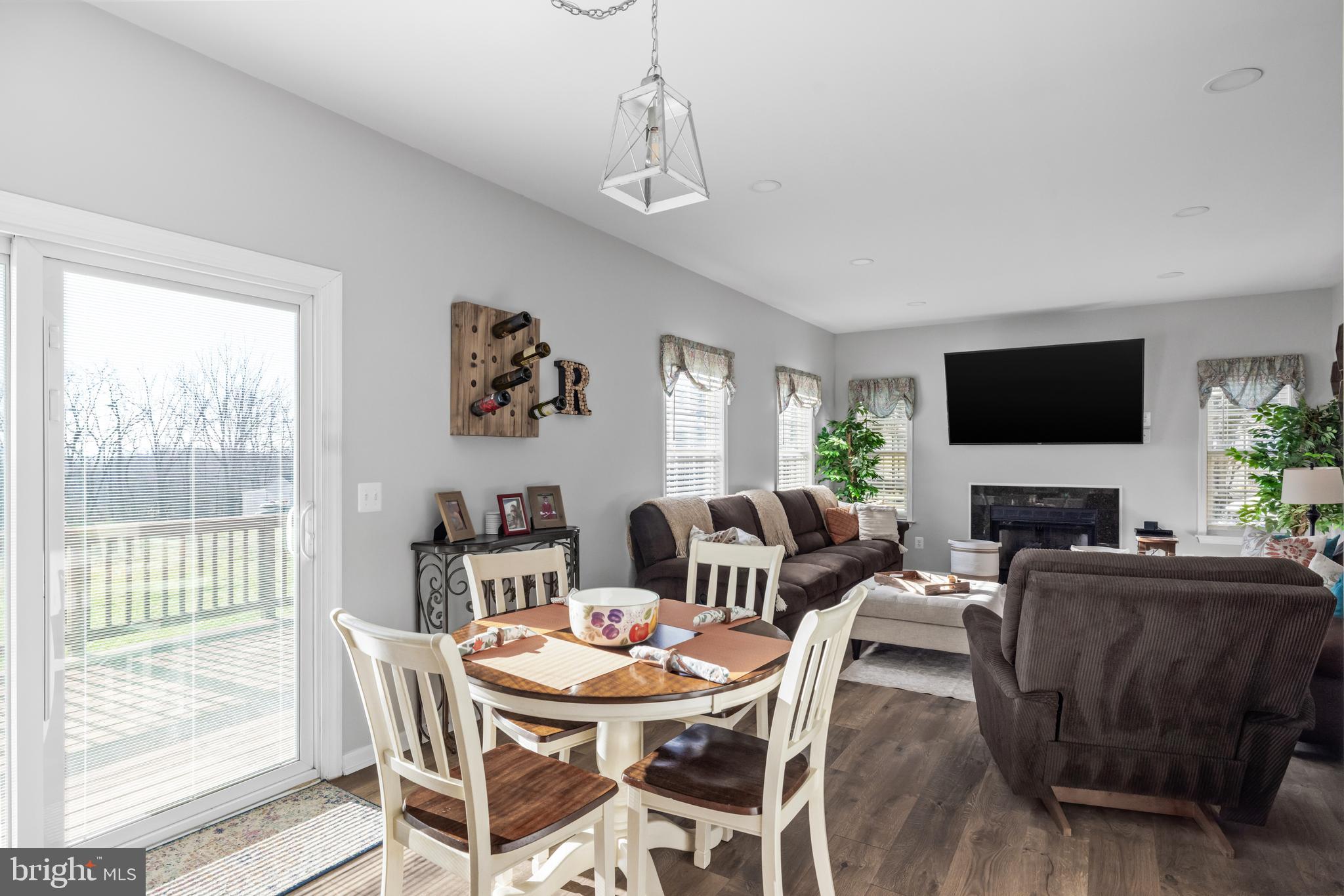 404 Pinnacle Drive Bunker Hill, WV 25413 - Photo 7 of 36 a view of a dining room with furniture window and wooden floor
