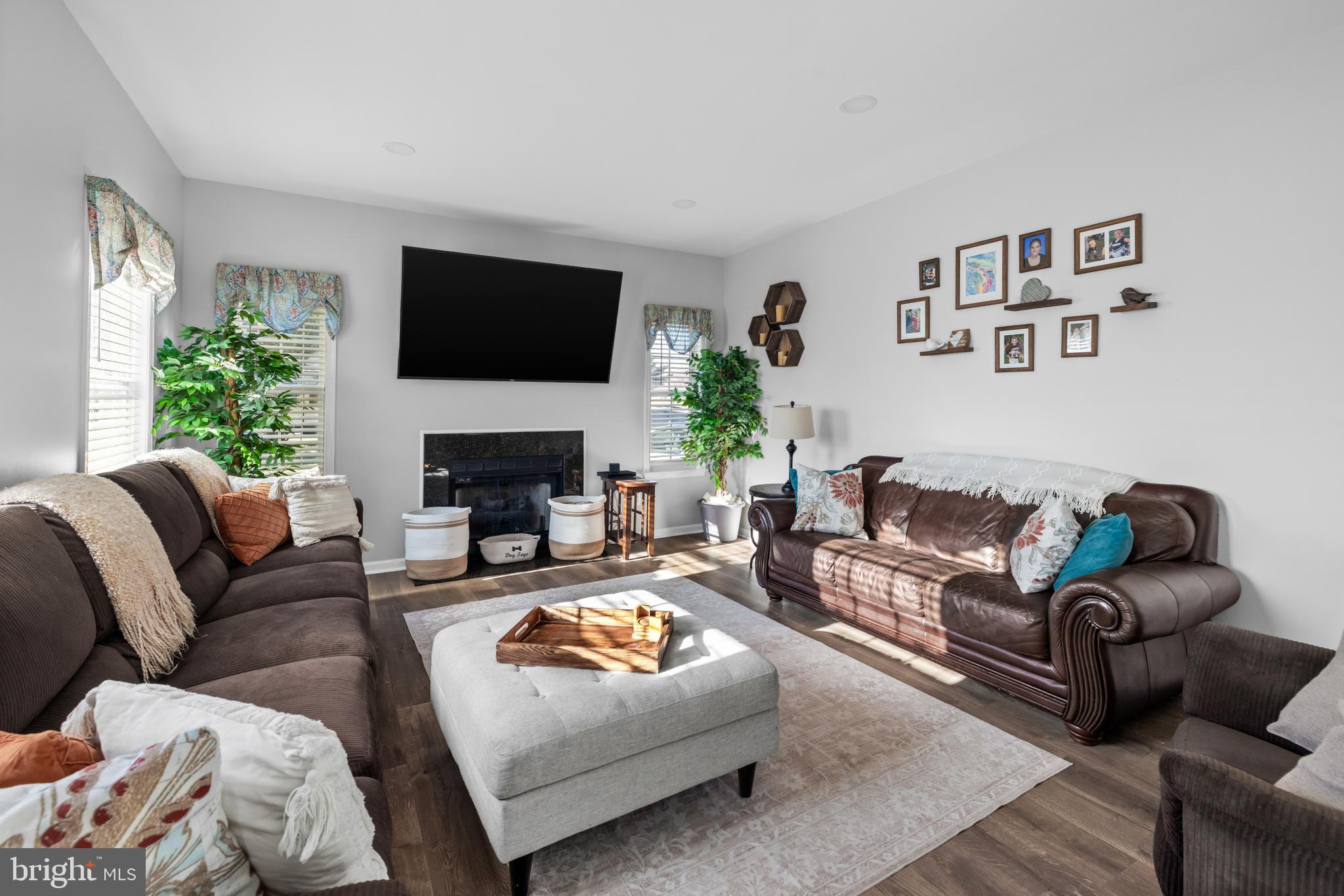 404 Pinnacle Drive Bunker Hill, WV 25413 - Photo 8 of 36 a living room with furniture fireplace and a flat screen tv