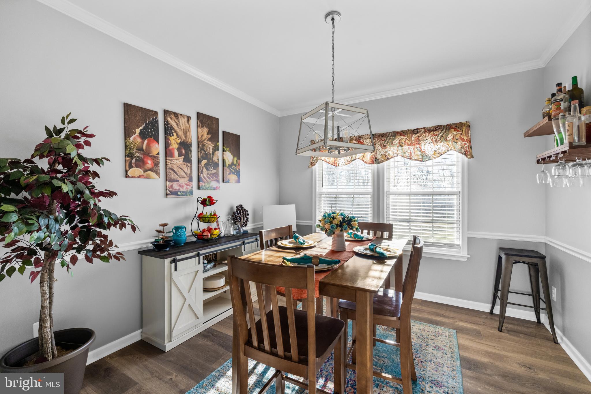 404 Pinnacle Drive Bunker Hill, WV 25413 - Photo 10 of 36 a view of a dining room with furniture window and wooden floor