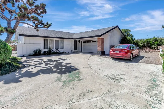 an aerial view of a house with a outdoor space