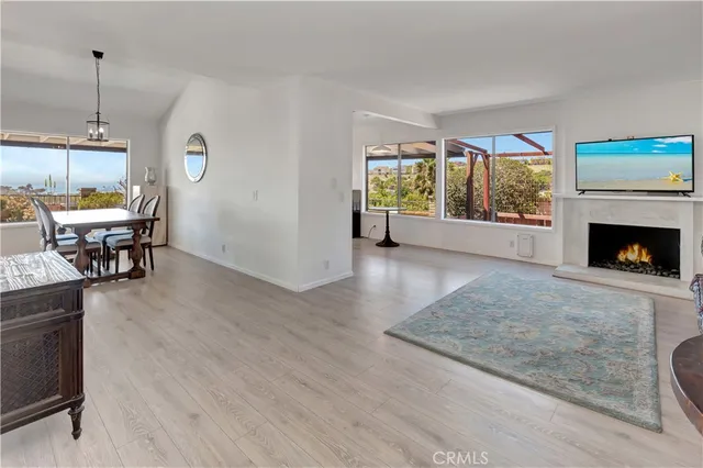 a view of a room with furniture wooden floor and window