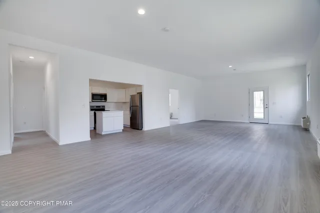 a view of a kitchen with a sink and a stove top oven
