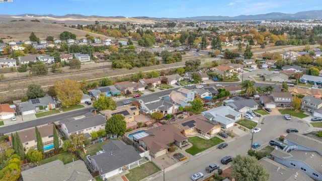 an aerial view of residential houses with outdoor space