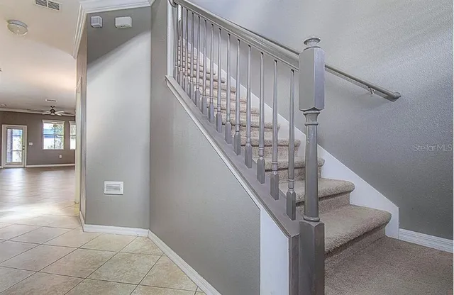 a kitchen with stainless steel appliances granite countertop a sink a stove and a microwave