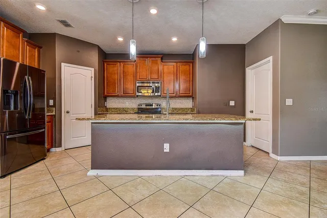 a view of a livingroom with a ceiling fan and window