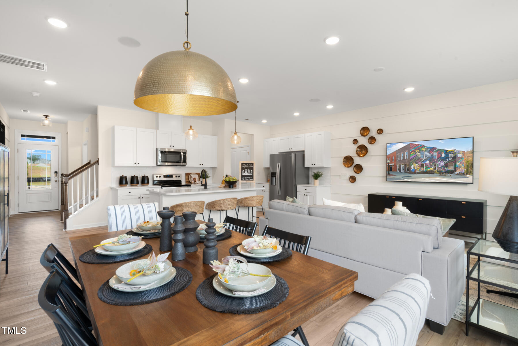 159 Siebold Street Garner, NC 27529 - Photo 15 of 36 a view of a dining room with furniture and a kitchen view