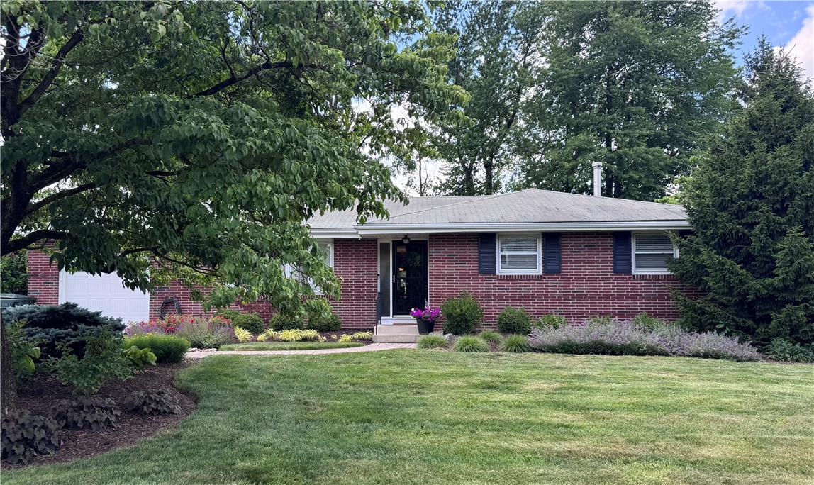 5334 Egypt Road Laurys Station, PA 18059 - Photo 2 of 55 Well-maintained brick residence with a neatly manicured lawn and vibrant landscaping, offering inviting curb appeal.