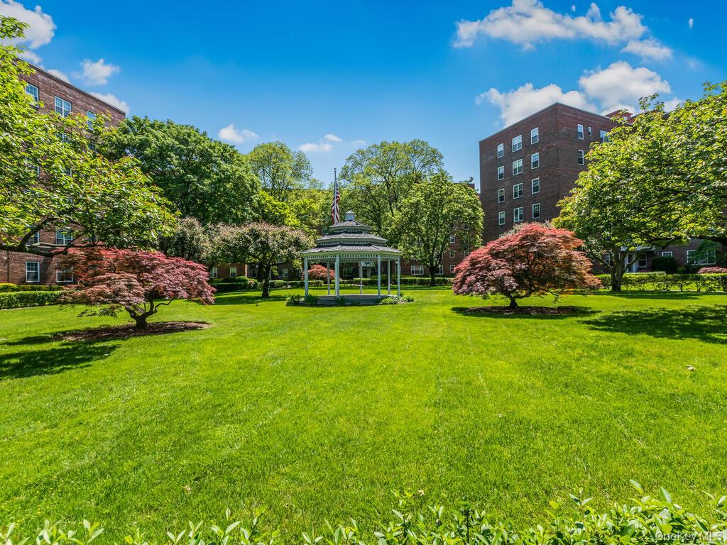 230 Pelham Road, Unit 2H New Rochelle, NY 10805 - Photo 23 of 29 View of green lawn with a gazebo
