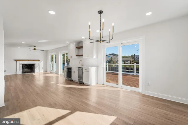 a view of a kitchen with a sink and a fireplace