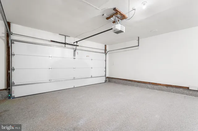 a view of a room with an empty ceiling fan